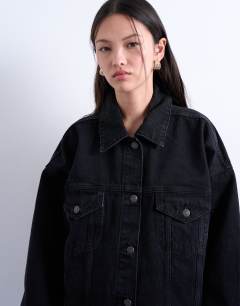 Model wearing Denim balloon sleeve oversized jacket in washed black
