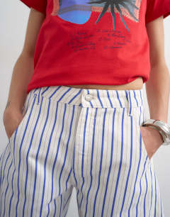 Model wearing Denim barrel jort in blue stripe