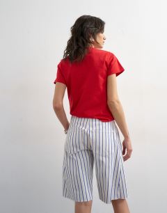 Model wearing Denim barrel jort in blue stripe