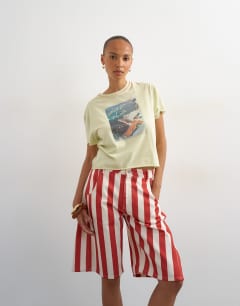 Model wearing Denim barrel jort in red stripe