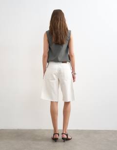 Model wearing Denim barrel jort in white