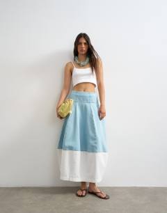Model wearing Denim barrel seamed maxi skirt in bleach and ecru