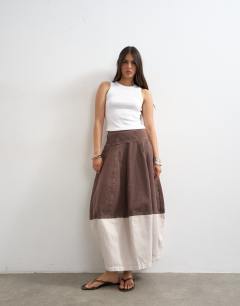 Model wearing Denim barrel seamed maxi skirt in brown and ecru