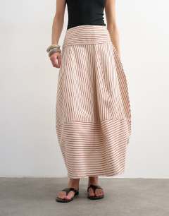 Model wearing Denim barrel seamed maxi skirt in red and ecru stripe