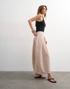 Model wearing Denim barrel seamed maxi skirt in red and ecru stripe