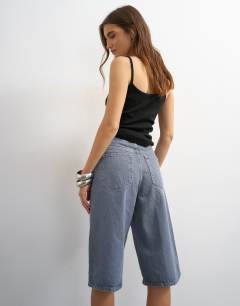 Model wearing Denim bermuda short in grey