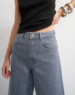 Model wearing Denim bermuda short in grey