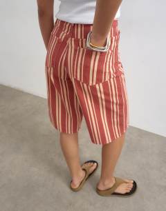 Model wearing Denim bermuda short in red stripe