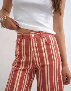 Model wearing Denim bermuda short in red stripe