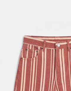 Model wearing Denim bermuda short in red stripe