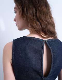 Model wearing Denim boat neck top in indigo rinse
