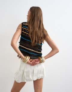 Model wearing Denim bubble hem mini skirt in bone