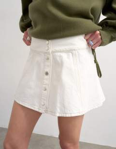 Model wearing Denim button through mini skirt in ecru