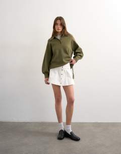 Model wearing Denim button through mini skirt in ecru