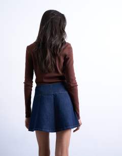 Model wearing Denim button through mini skirt in indigo rinse