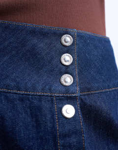Model wearing Denim button through mini skirt in indigo rinse