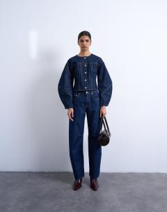 Model wearing Denim cinch back shirt with ovoid sleeve in rinse