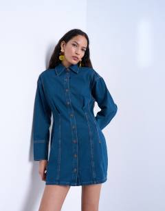 Model wearing Denim cinch detail mini dress in blue black