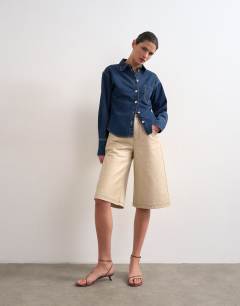 Model wearing Denim cinch detail shirt in indigo