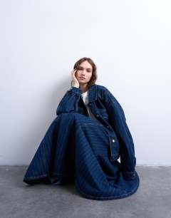 Model wearing Denim circle maxi skirt in indigo stripe