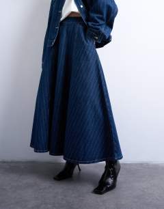Model wearing Denim circle maxi skirt in indigo stripe