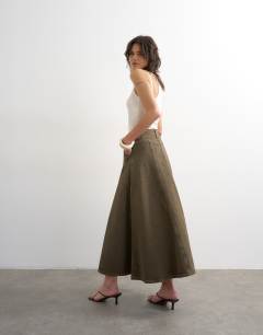 Model wearing Denim circle seamed maxi skirt in olive