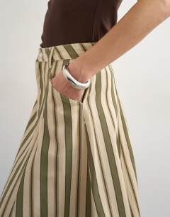 Model wearing Denim circle seamed maxi skirt in stripe