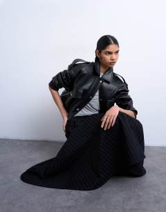 Model wearing Denim circle skirt in black stripe