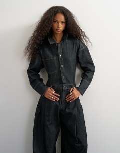 Model wearing Denim cocoon jumpsuit in black