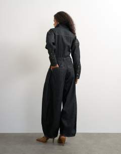 Model wearing Denim cocoon jumpsuit in black