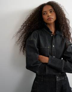 Model wearing Denim cocoon jumpsuit in black