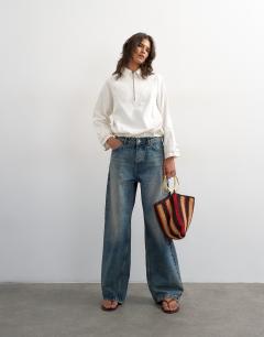 Model wearing Denim collared quarter zip blouson jacket in bone