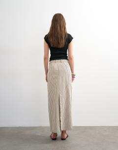 Model wearing Denim column maxi skirt in black and ecru stripe