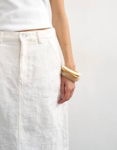 Model wearing Denim column maxi skirt in distressed ecru