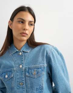 Model wearing Denim cropped padded shoulder jacket in bleach