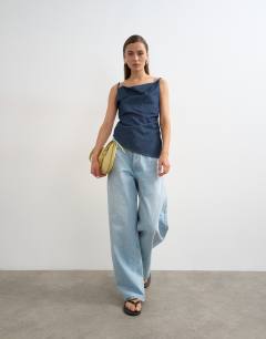 Model wearing Denim draped neck ruched top in indigo rinse