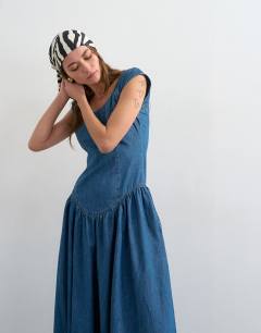 Model wearing Denim drop waist midi dress in indigo rinse