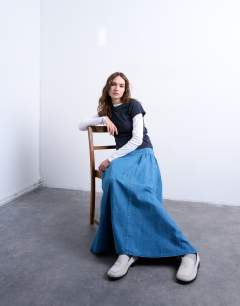 Model wearing Denim dropwaist maxi skirt in blue