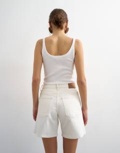 Model wearing Denim Editor comfort stretch short in bone
