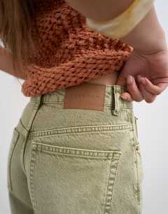 Model wearing Denim Editor short in apple green