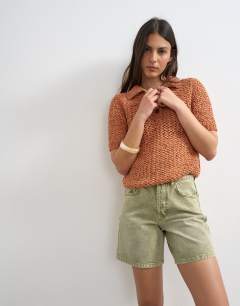 Model wearing Denim Editor short in apple green
