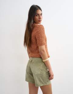 Model wearing Denim Editor short in apple green