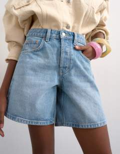 Model wearing Denim Editor short in bleach