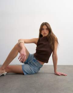 Model wearing Denim Editor short in bleach