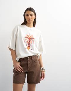 Model wearing Denim Editor short in brown