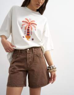 Model wearing Denim Editor short in brown