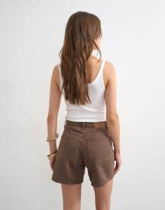 Model wearing Denim Editor short in brown