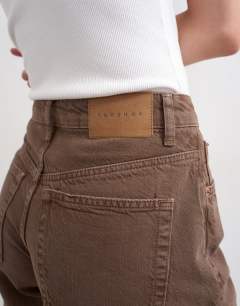 Model wearing Denim Editor short in brown