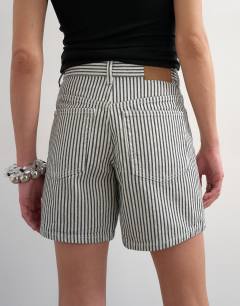 Model wearing Denim Editor short in ecru stripe