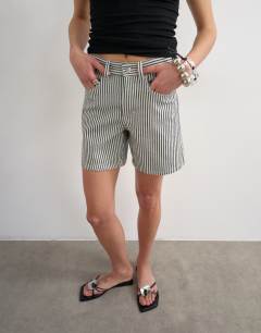 Model wearing Denim Editor short in ecru stripe